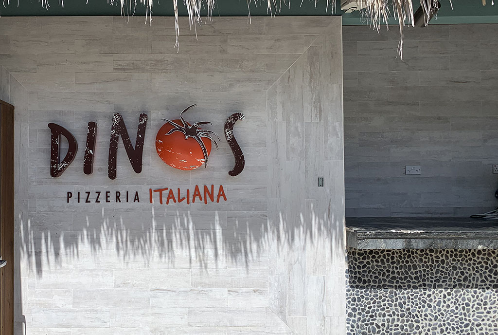 Another shot of the Dinos Pizzeria Italiana Sign at Sandals Grenada